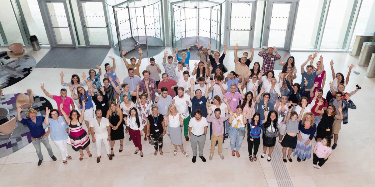 Group of people waving